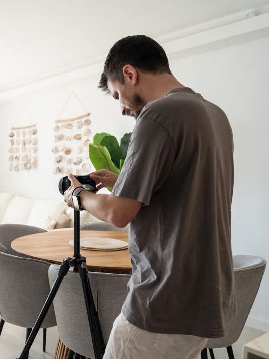 House of Mojo media team member setting up a camera for property photography inside a Costa del Sol home